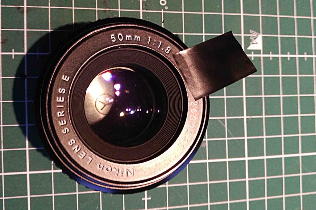 Cleaning of a Nikon 50mm f/1.8 E lens. Bezel turning